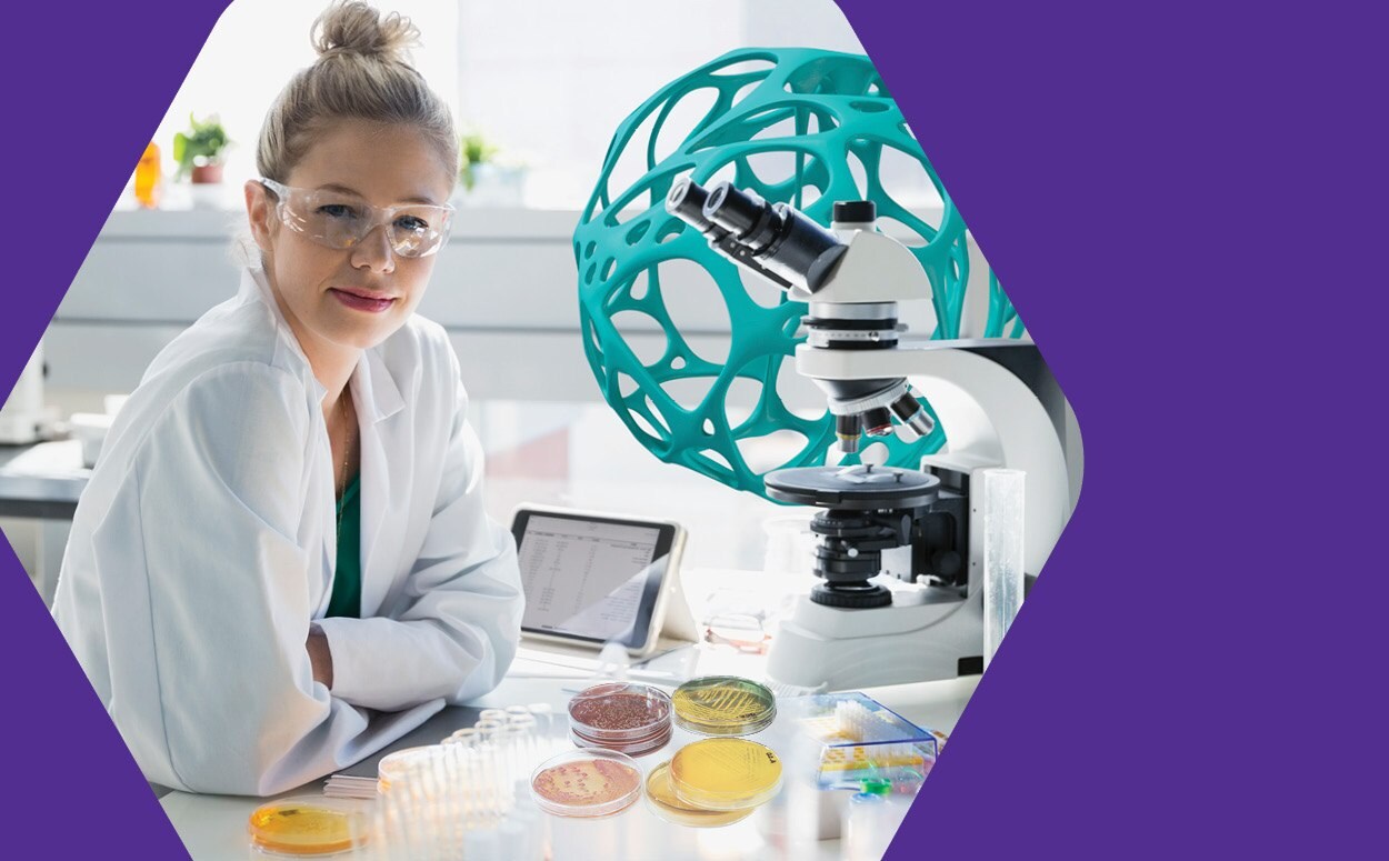 Lab worker at a lab table.