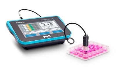 Photograph of a Millicell ERS 3.0 Digital Voltohmmeter, with standing in-well probe in a 24-well plate of cell culture inserts.