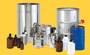 A grouping of steel chemicals, dark glass and plastic jugs signifying bulk chemicals and custom services for chemical manufacturing