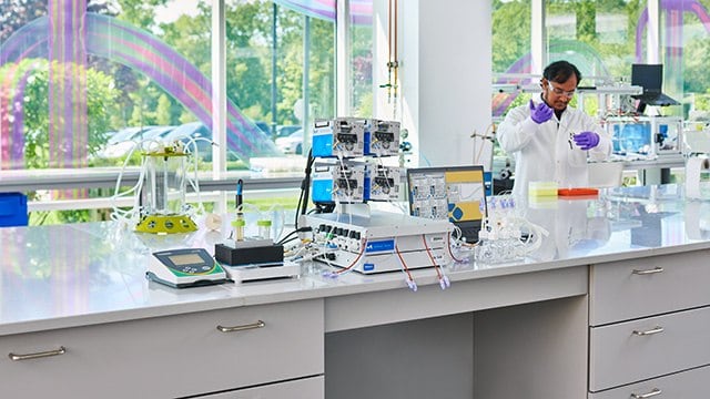 Scientist at a lab table