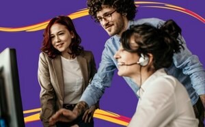 Three people working together in an office, looking at a computer screen, set against a purple background with yellow and red swirls.