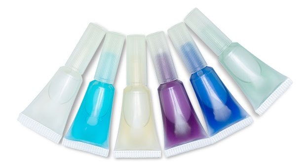 A collection of six 2 mL ready-to-use media ampoules in various colors are placed against a white background